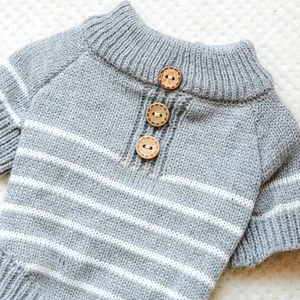 Detail of grey and white striped pet sweater showing soft knit texture and wooden buttons