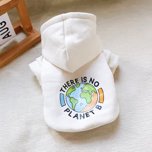 Detailed close-up of cream pet hoodie featuring colorful earth graphic and eco slogan