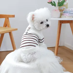 Close-up of striped pet knit sweater with three decorative wood buttons on dog