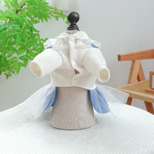 Detailed close-up of pet dress showing knit fabric texture and pearl neckline accents