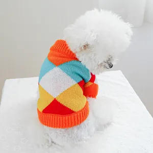 Detail of colorful argyle knit sweater with orange ribbed edges for small dogs and cats