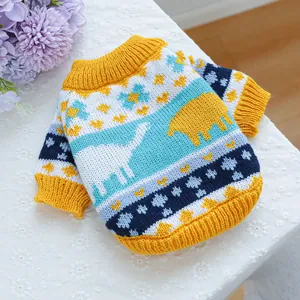 Detailed close-up of knitted pet sweater with colorful dinosaur and star patterns