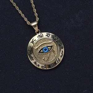Detail of Eye of Horus gold coin pendant with blue accents and ancient symbols