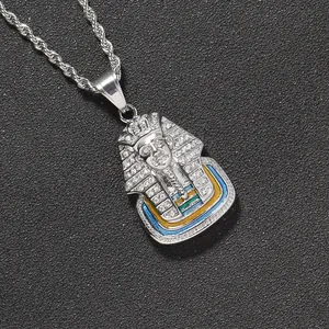 Detailed close-up of Egyptian Pharaoh pendant with sparkling crystals and enamel details