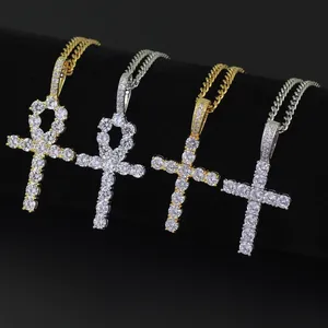 Detailed view of hip hop Ankh and Latin cross pendants with micro-set cubic zirconia