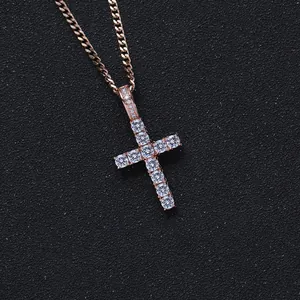 Macro shot of rose gold Ankh cross pendant with micro-paved white zircon stones