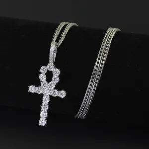 Close-up of iced out silver Ankh pendant with cubic zirconia on a Cuban link chain