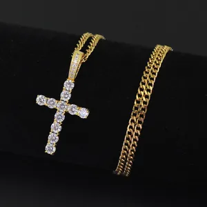 Macro detail of gold plated Ankh cross pendant with micro-paved cubic zirconia stones