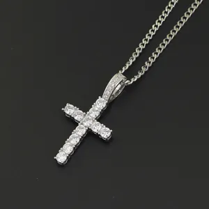 Close-up of silver-tone Ankh cross pendant with micro-pave cubic zirconia on black texture