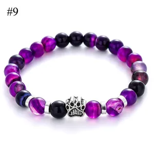 Close-up of 8mm purple agate beads bracelet with a silver metal dog paw charm