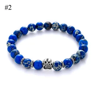 8mm natural stone beaded bracelet with blue stone beads and a silver cat paw pendant