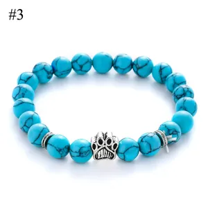 Blue turquoise stone bead bracelet with silver pet paw charm and textured metal spacers