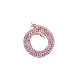 Detail of 4mm rose gold tennis chain with pink round-cut cubic zirconia in 4-prong setting