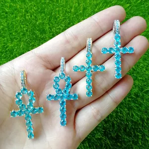 Macro detail of blue zircon Ankh and cross pendants with S925 silver and gold plating