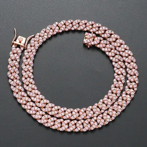 Detail of rose gold Cuban link necklace featuring micro-pave zircon and a secure clasp
