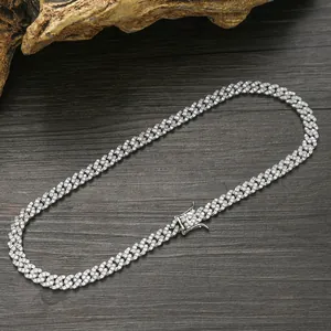 Detailed view of silver Cuban link necklace box clasp with iced out cubic zirconia stones