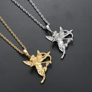 Macro detail of 3D Cupid angel pendant in gold and silver finish on a twisted rope chain