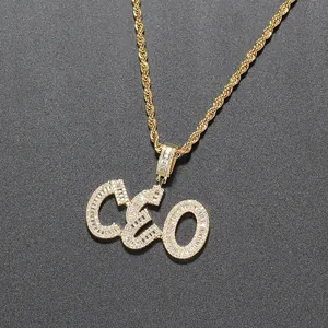 Detailed macro view of the gold-plated iced-out CEO pendant with cubic zirconia stones