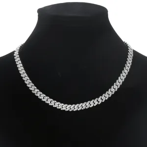 Close-up of 8mm silver Cuban link necklace with three CZ stones on black velvet bust