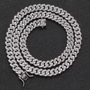 Detailed close-up of 8mm silver iced out Cuban link chain with three cubic zirconia stones