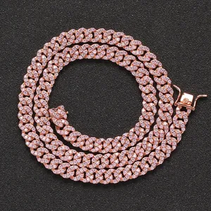 Close-up of rose gold Cuban link necklace with pink zircons and secure box clasp