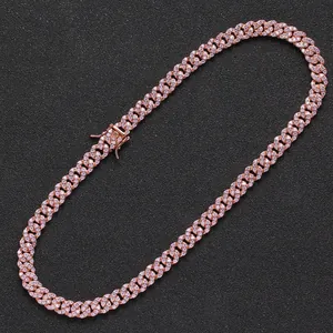Detailed macro view of a rose gold Cuban link necklace with micro-paved cubic zirconia stones