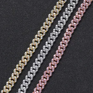 Detail of 8mm Cuban link chains with pave-set cubic zirconia in gold, silver, and rose gold