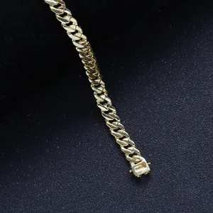 Detail showing the 925 silver hallmark on a gold Cuban link chain with secure clasp