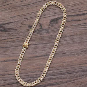 Detail of 8mm golden Cuban link necklace featuring three rows of zircon pavé settings
