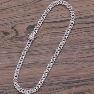 Detail of 8mm Cuban link necklace with three zircons and iced-out box clasp