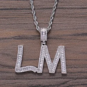 Close-up of LM letter pendant with baguette-cut zircons on a silver rope chain