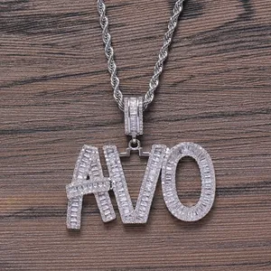 Close-up of AVO silver necklace with full pave zircon stones on rustic wood background