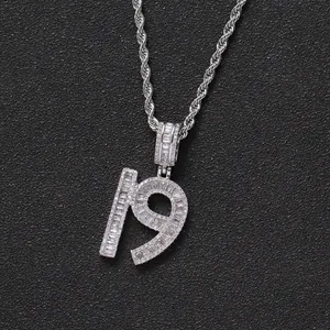 Macro shot of silver hip-hop pendant number 19 encrusted with baguette-cut zircons