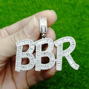 Macro shot of silver BBR letter pendant with full cubic zirconia stones and pavé bail