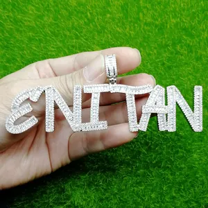 Macro view of ENITAN iced-out hip hop pendant with cubic zirconia inlay craftsmanship