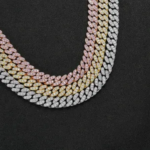 Macro detail showing gold, silver, and rose gold pavé-set 12mm hiphop Cuban link chains
