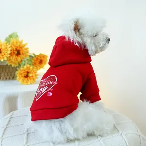 Detail of red Valentine's Day pet hoodie featuring white heart patterns for small dogs