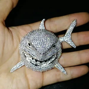 Macro view of iced out shark pendant with silver-plated copper and cubic zirconia