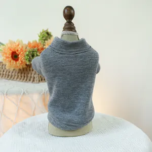 Close-up of grey knit pet sweater with ribbed collar on a small mannequin