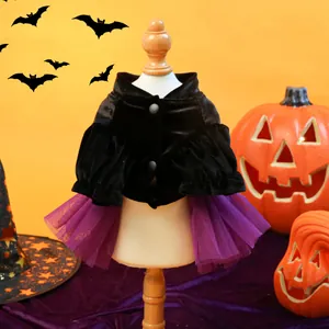 Halloween pet set with black velvet cloak and purple mesh skirt displayed on a wooden hanger
