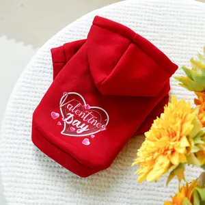 Detail of red Valentine's Day pet hoodie with heart prints and festive typography
