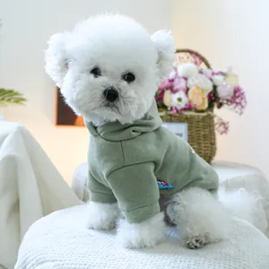 Sage green dog hoodie detail showing elastic cuffs and premium side brand label