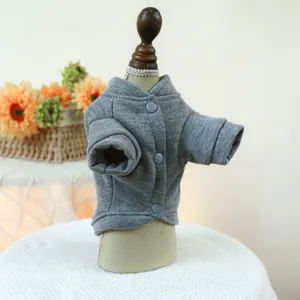 Detail of grey pet sweatshirt with snap buttons on a wooden mannequin for small dogs