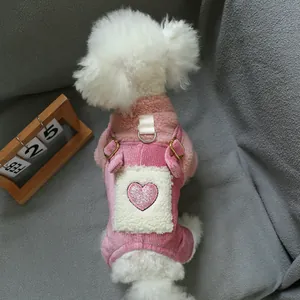 Pink plush pet overall with heart patch and metal D-ring for leash attachment