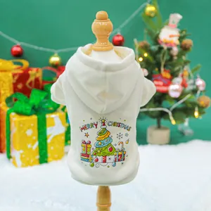 Detail of cream pet Christmas hoodie with colorful tree print on a wooden model