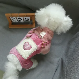 Detail of pink pet overalls with sequined heart, fleece lining and metal D-ring buckle