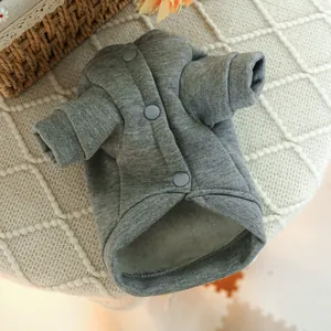 Close-up of grey fleece-lined pet sweater with snap button closure and ribbed cuffs