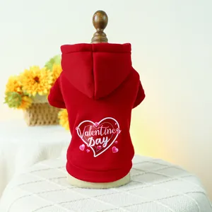 Red Valentine's Day pet hoodie with pink hearts for dogs and cats on a display stand
