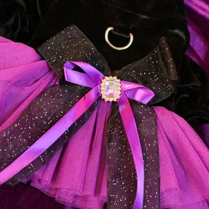 Detail of purple tulle pet dress with velvet bodice and iridescent rhinestone bow