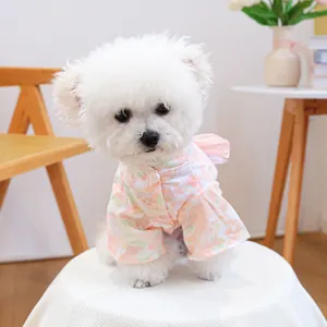 Detailed view of pink floral pet kimono featuring a large decorative bow on the back